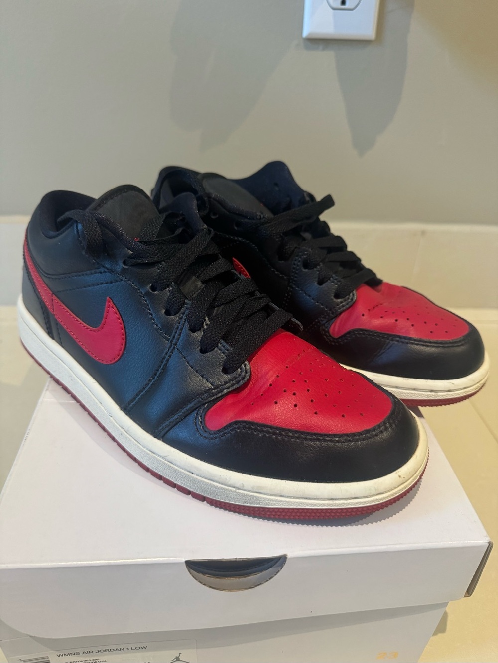 Nike Black and Red women’s air Jordan 1 Low-Top Sneakers